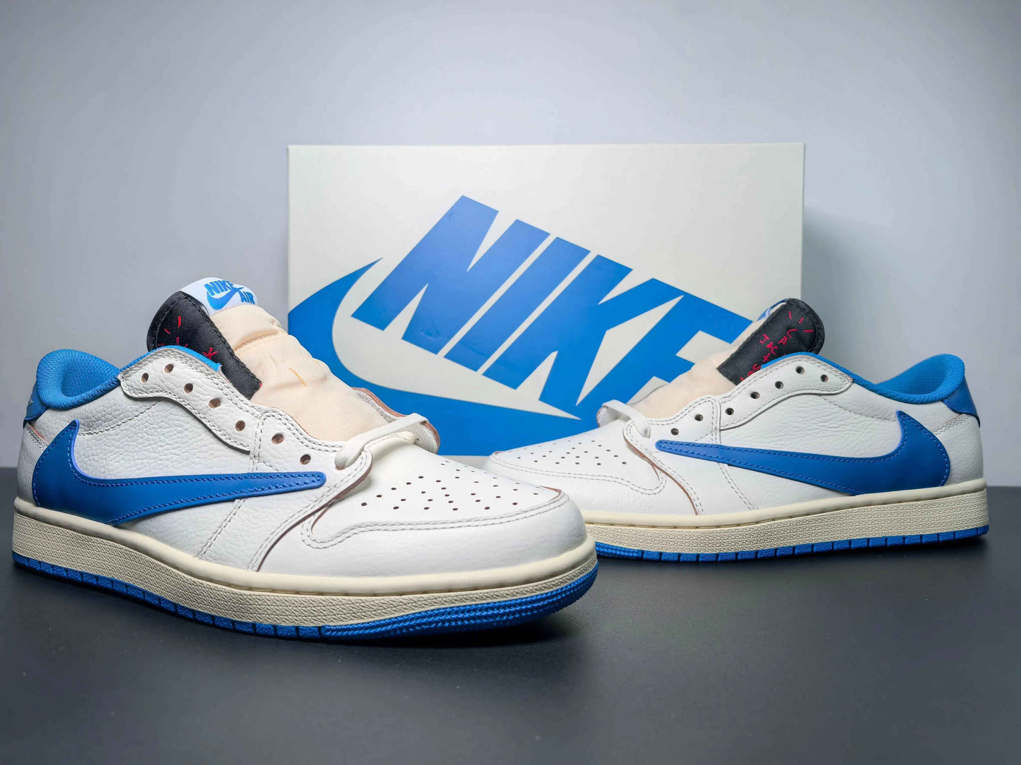 White and blue custom Air Jordan 1 low sneakers with Nike branding, luxury urban wear style