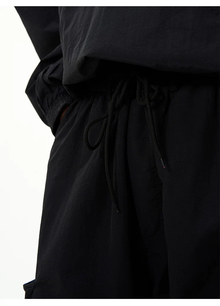 All-Black Oversized Windbreaker and Cargo Pants Setup